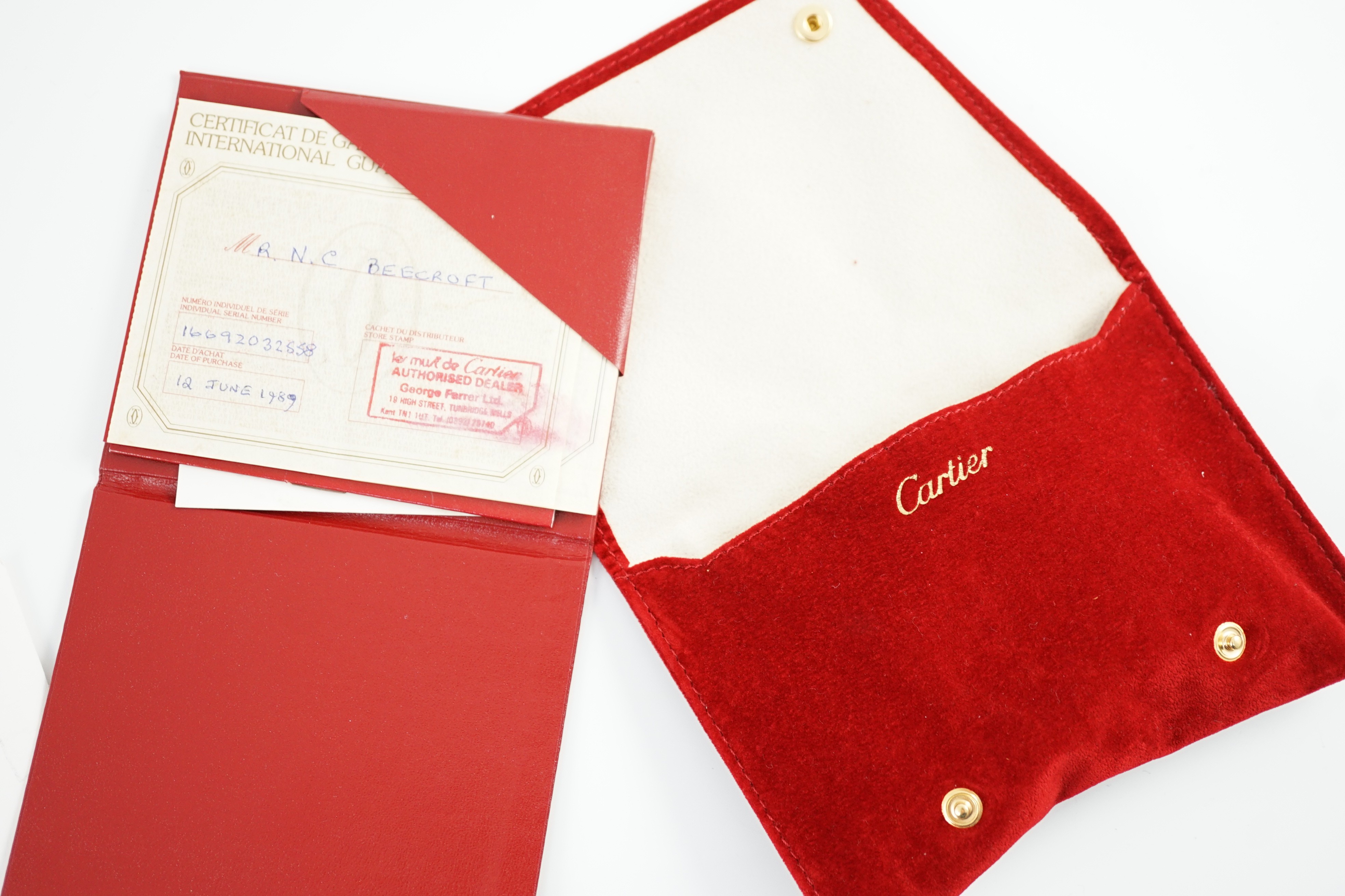 A lady's modern steel and gold Cartier Santos Ronde manual wind wrist watch, on Cartier bracelet with deployment clasp